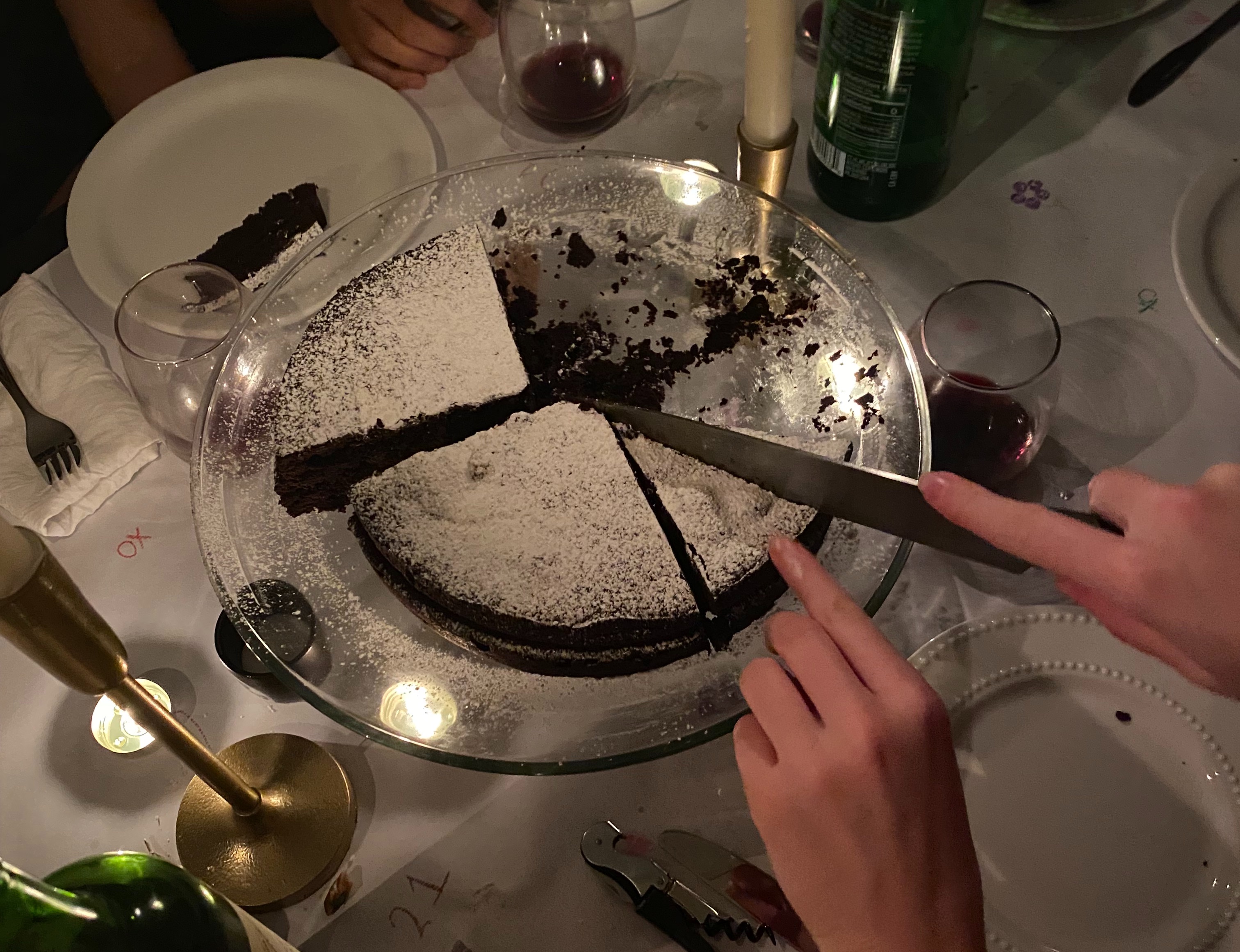 Cora cutting a cake